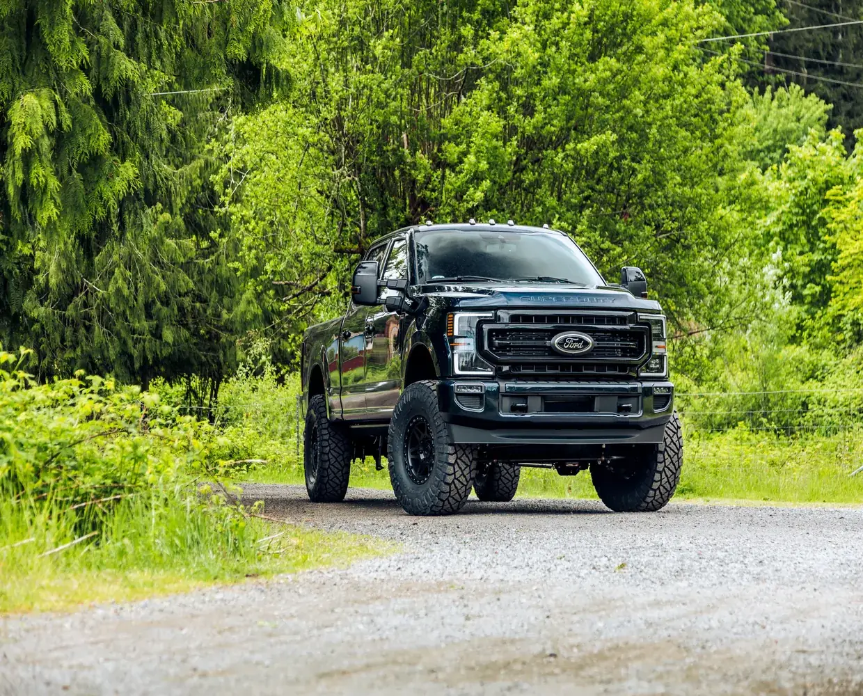 Lifted Ford Super Duty on a gravel road in the Colorado foothills
